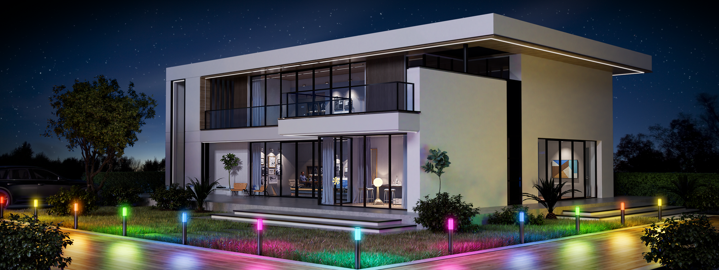 Smart pathway lights illuminating modern home landscape with multicolor lighting