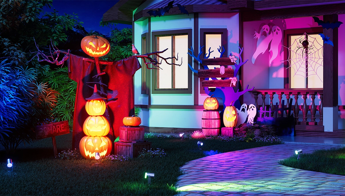 Smart outdoor spotlights creating colorful Halloween yard lighting for festive outdoor decorations