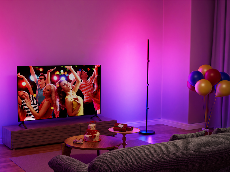 Smart floor lamp creating cozy holiday lighting for living room