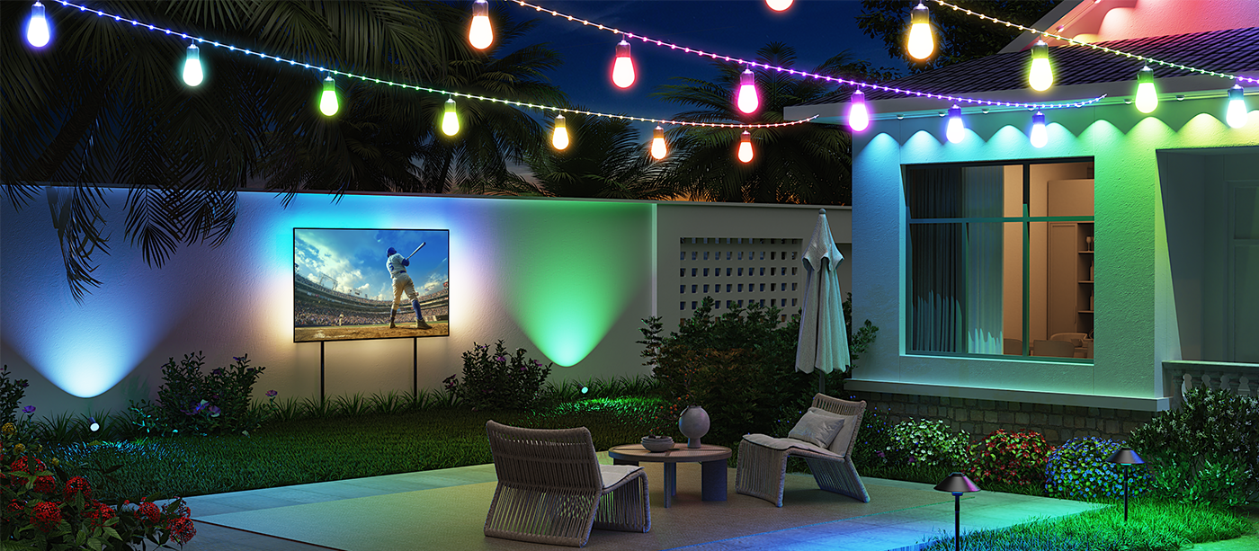 Colorful outdoor string lights illuminate a backyard with a large TV displaying a baseball game, creating a festive ambiance for outdoor gatherings. Black Friday sale on smart lighting.